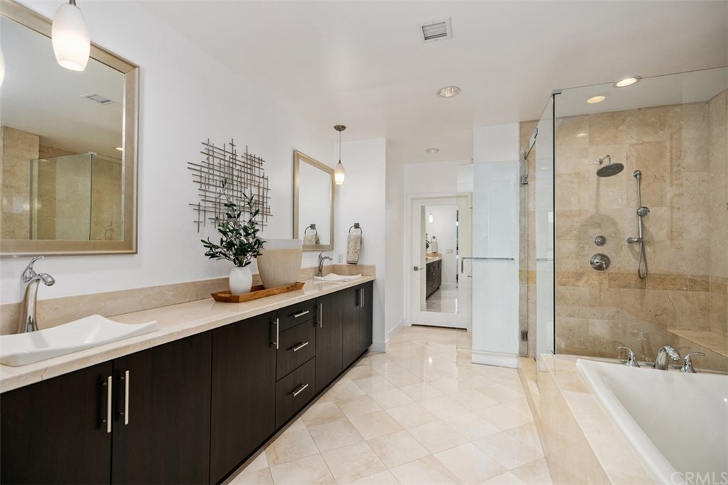 402 Rockefeller, Unit 406 Irvine, CA 92612 - Photo 7 of 35 a spacious bathroom with a double vanity sink mirror double and shower