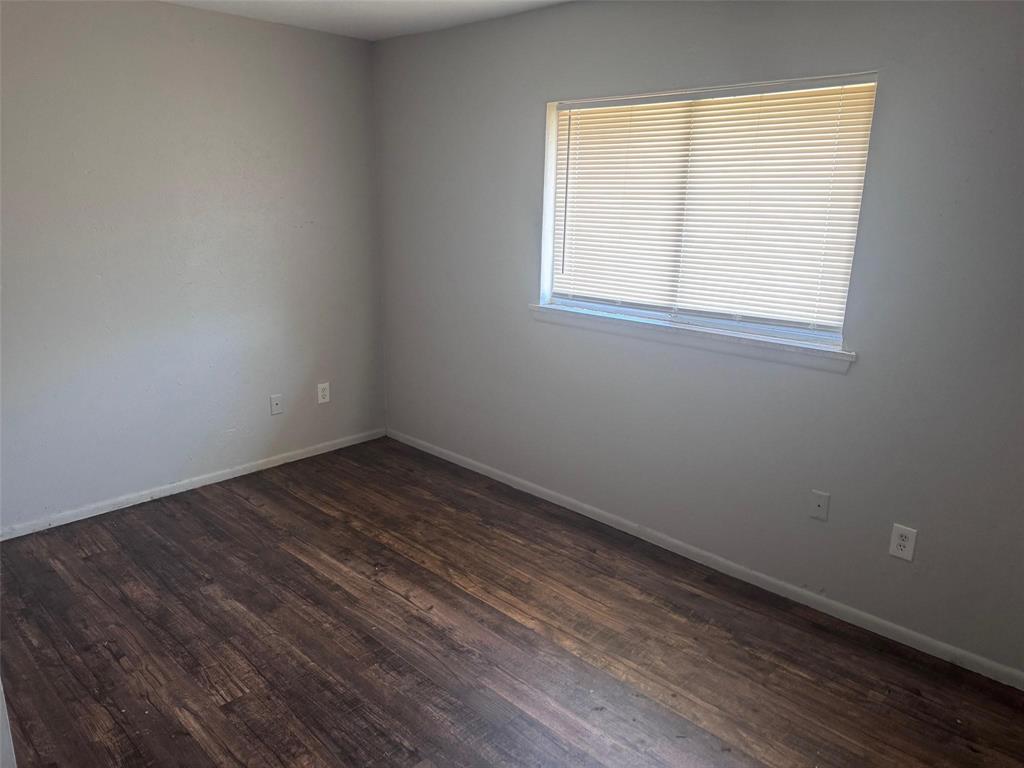 2112 Sunset Drive Brookston, TX 75421 - Photo 4 of 8 an empty room with a window
