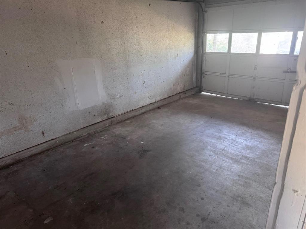2112 Sunset Drive Brookston, TX 75421 - Photo 7 of 8 an empty room with a empty space and window