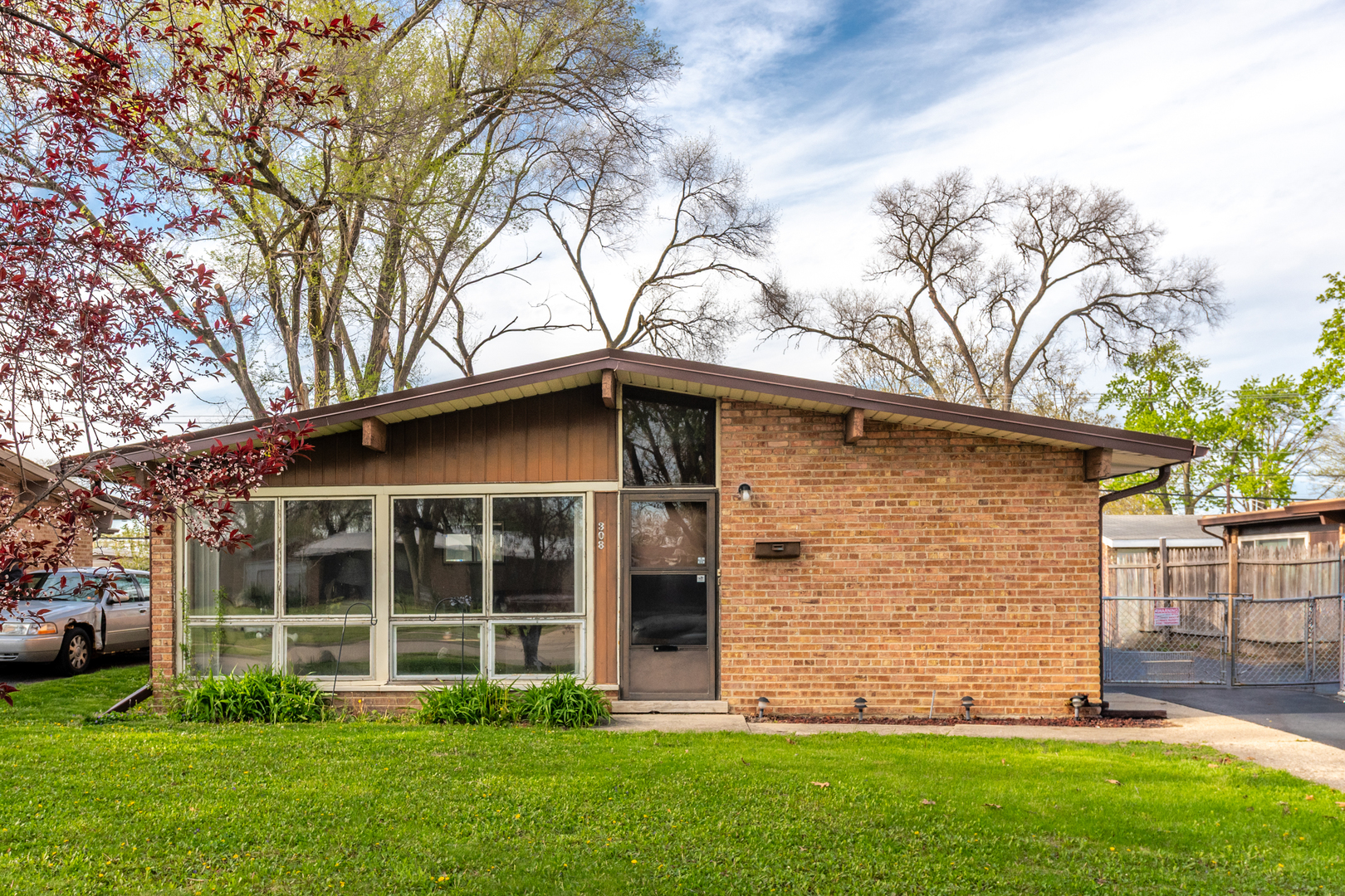 308 Natoma Avenue Addison, IL 60101 - Photo 1 of 21 a front view of a house with a garden