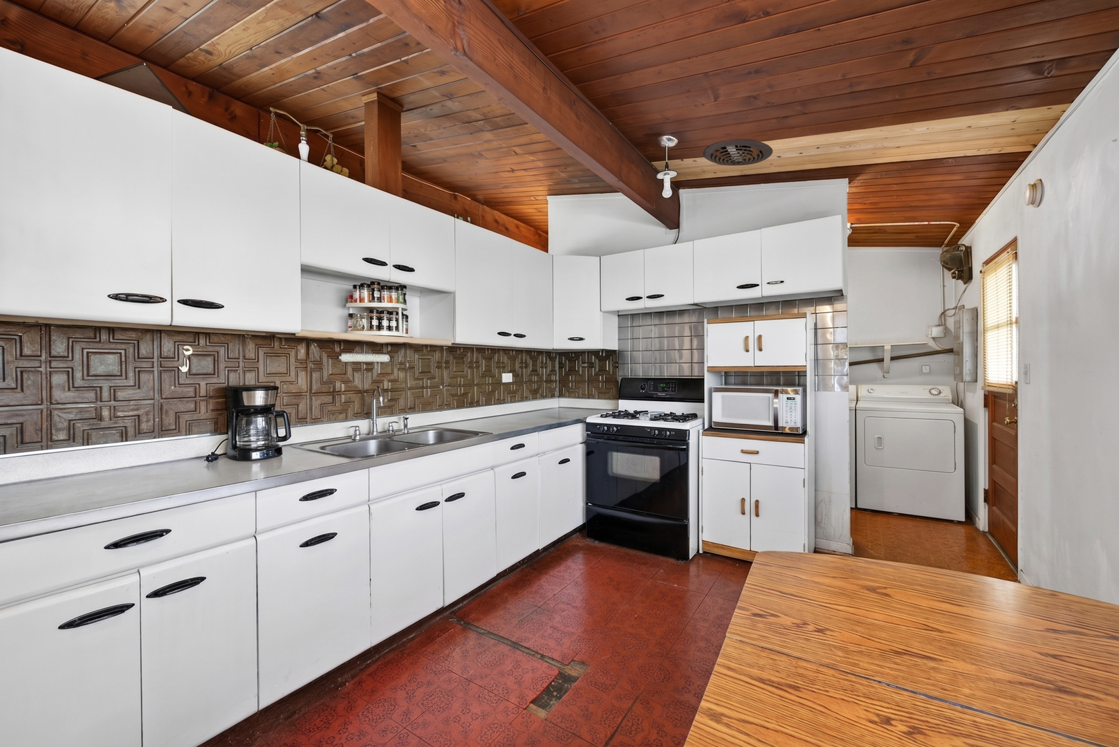308 Natoma Avenue Addison, IL 60101 - Photo 2 of 21 a kitchen with granite countertop a sink stainless steel appliances and cabinets