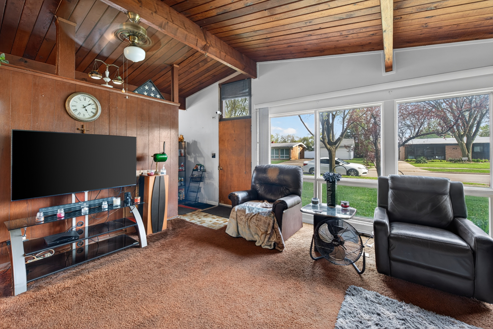 308 Natoma Avenue Addison, IL 60101 - Photo 7 of 21 a living room with furniture and a flat screen tv