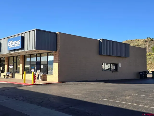 a front view of building with yard