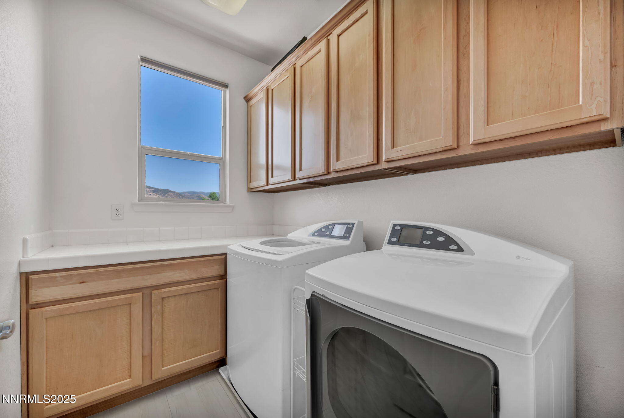 420 Miesque Court Reno, NV 89521 - Photo 25 of 43 a utility room with sink dryer and washer