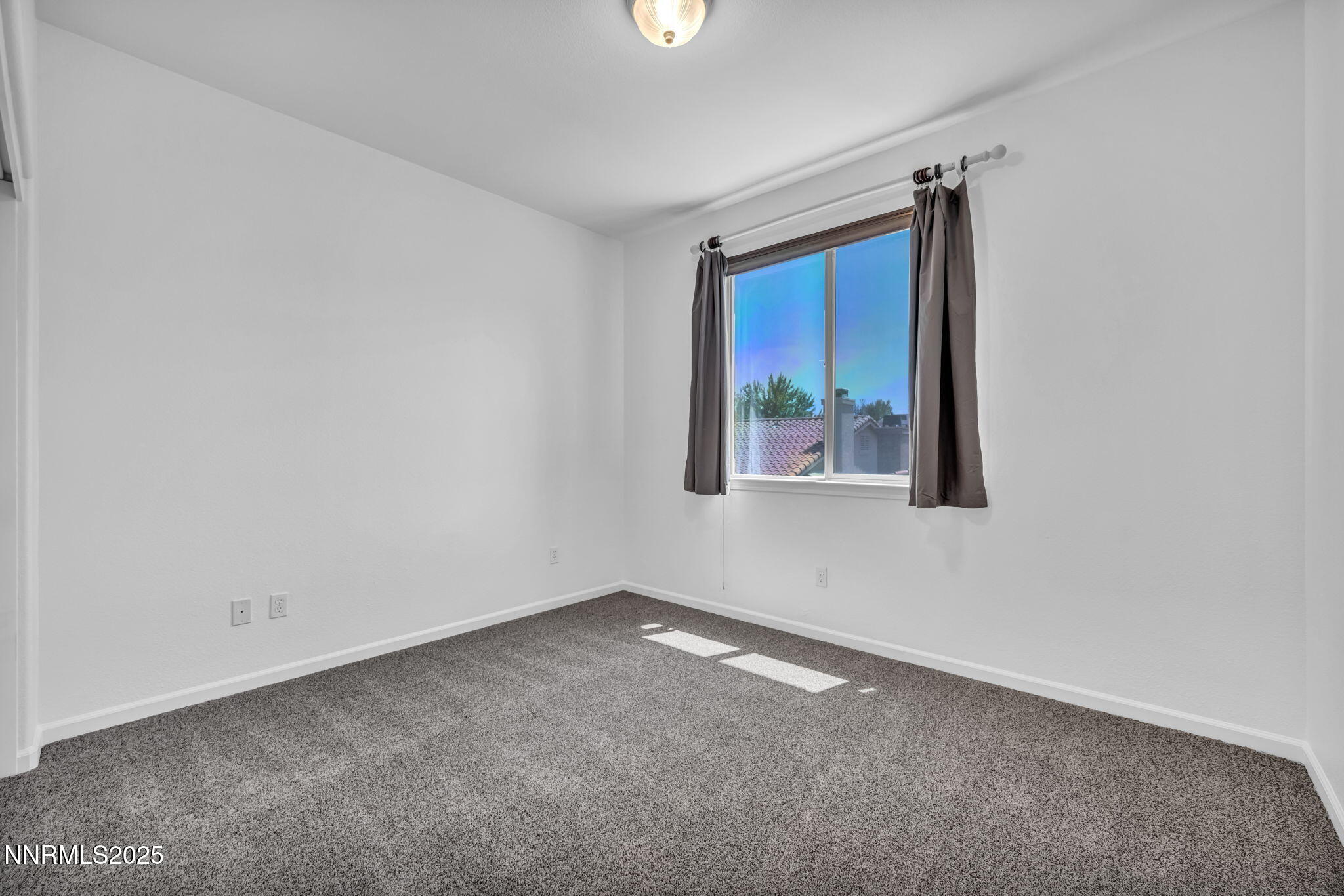 420 Miesque Court Reno, NV 89521 - Photo 29 of 43 a view of an empty room with a window