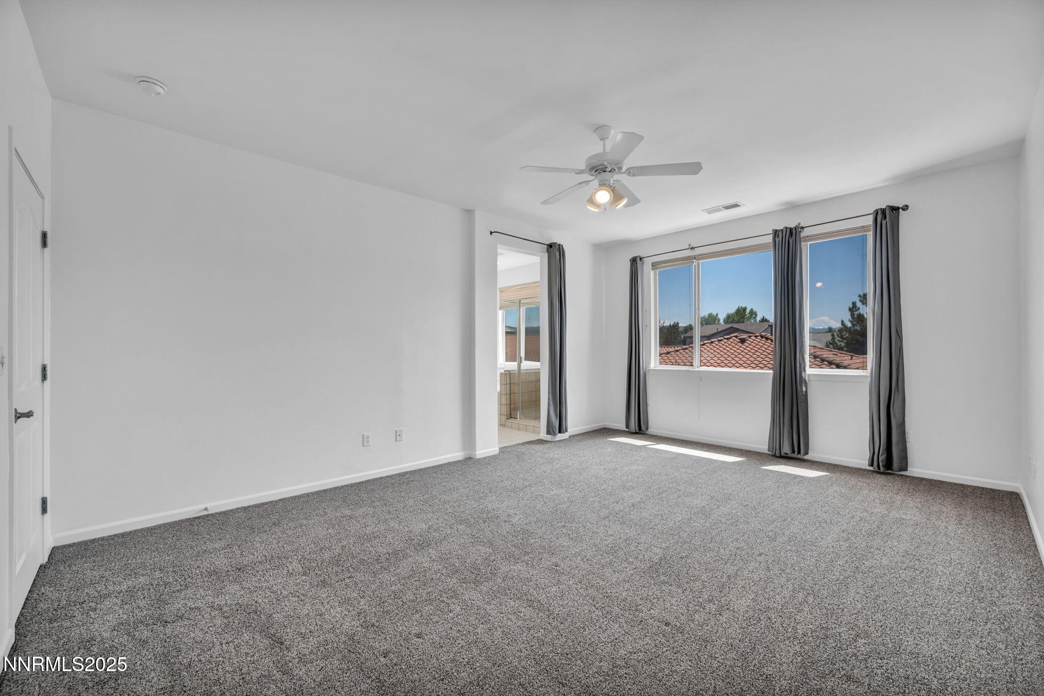 420 Miesque Court Reno, NV 89521 - Photo 32 of 43 a view of empty room with wooden floor