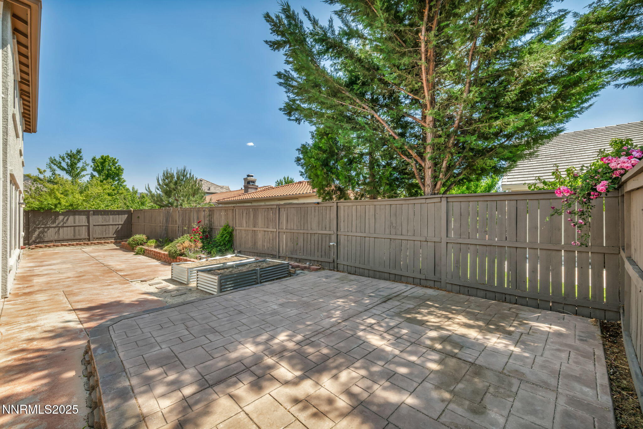 420 Miesque Court Reno, NV 89521 - Photo 42 of 43 a view of a backyard with a small cabin and wooden fence
