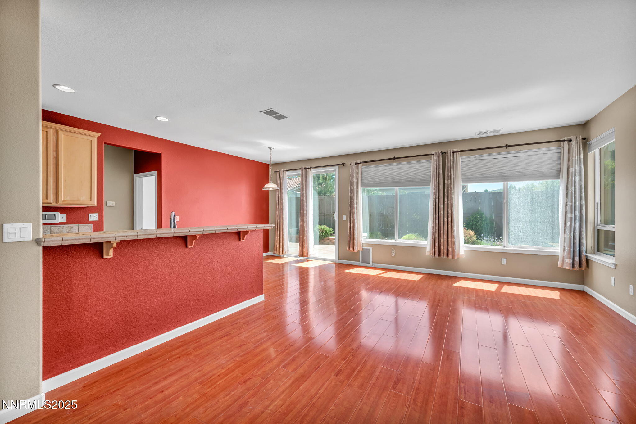 420 Miesque Court Reno, NV 89521 - Photo 6 of 43 a view of room with window and wooden floor