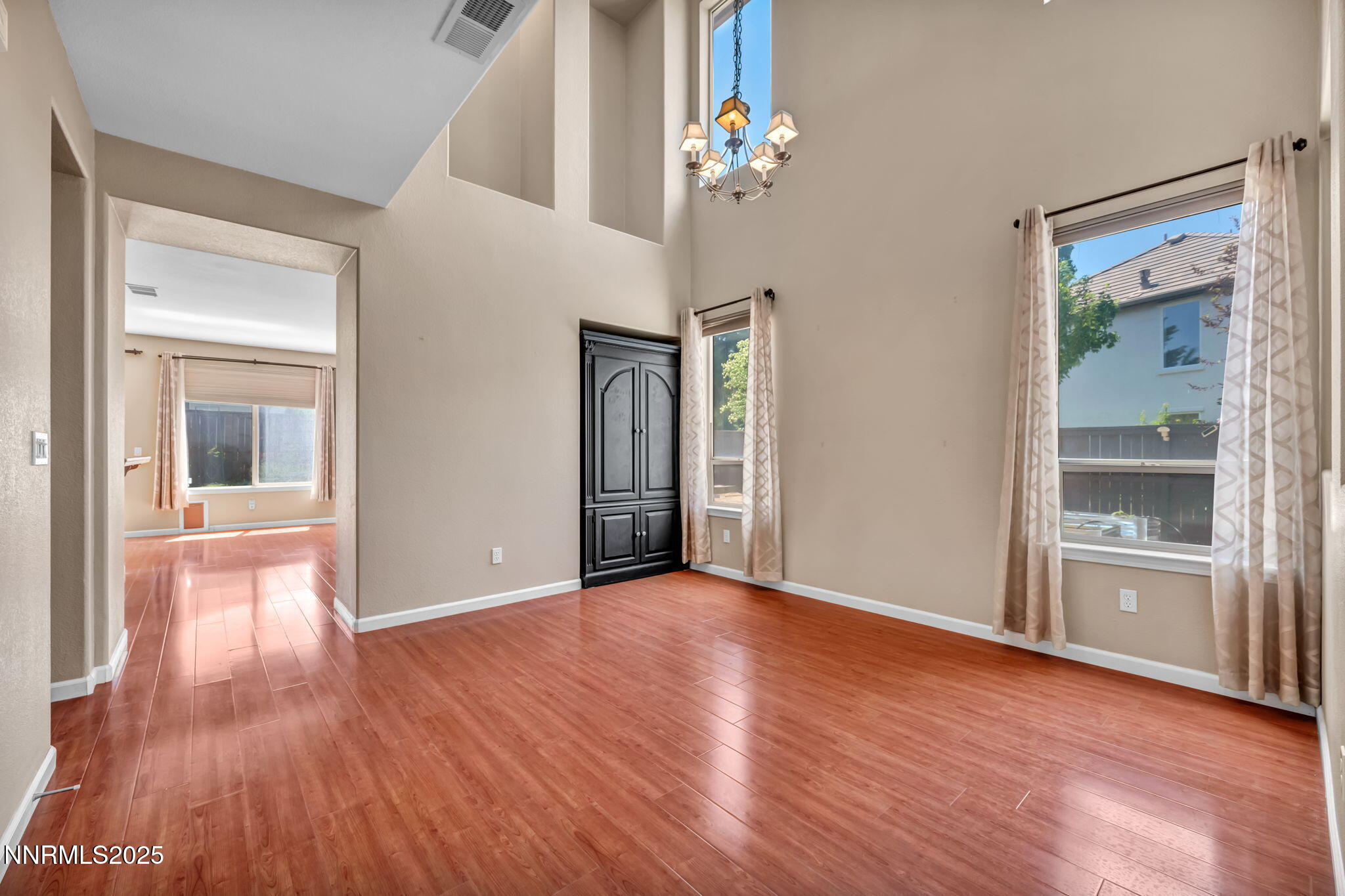 420 Miesque Court Reno, NV 89521 - Photo 8 of 43 wooden floor in an empty room with a window