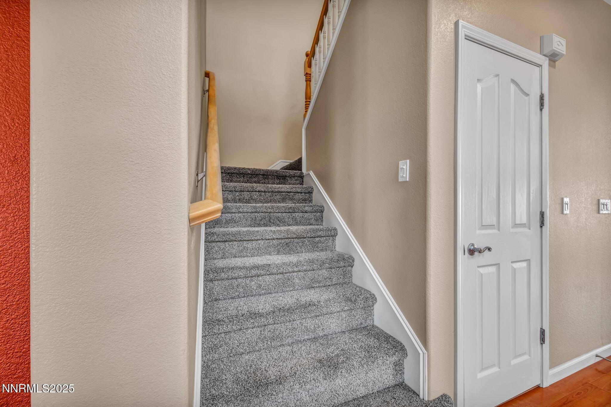 420 Miesque Court Reno, NV 89521 - Photo 10 of 43 a view of staircase with white walls and white door