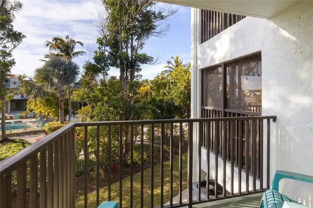 a view of a balcony with wooden floor