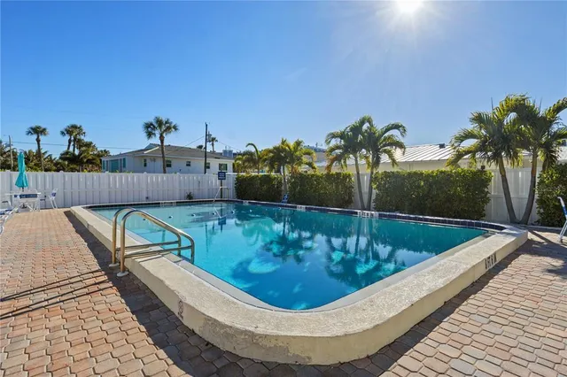 a view of a swimming pool with a patio