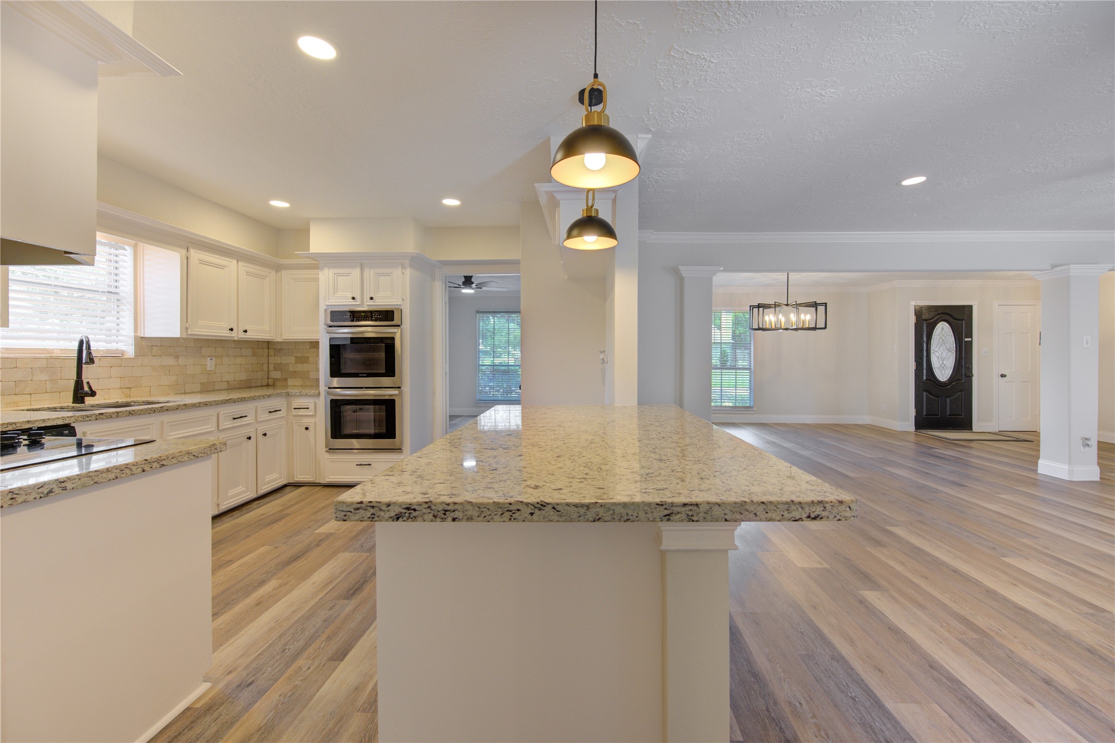 9115 Taidswood Drive Spring, TX 77379 - Photo 15 of 45 The kitchen is open to the family room with extended counter top for barstools.