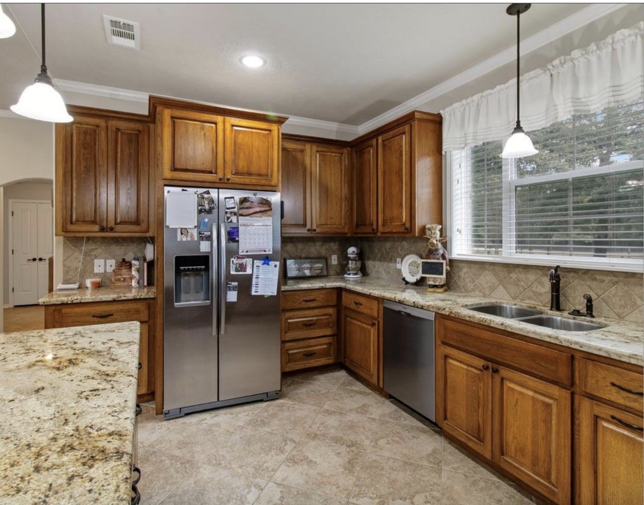 5177 PR 4052 Normangee, TX 77871 - Photo 12 of 20 a kitchen with stainless steel appliances granite countertop a refrigerator a stove top oven and a sink with cabinets