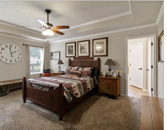 a bed room with a bed and a window