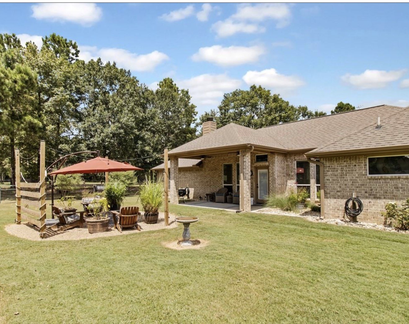 5177 PR 4052 Normangee, TX 77871 - Photo 2 of 20 a view of a swimming pool with lawn chairs under an umbrella