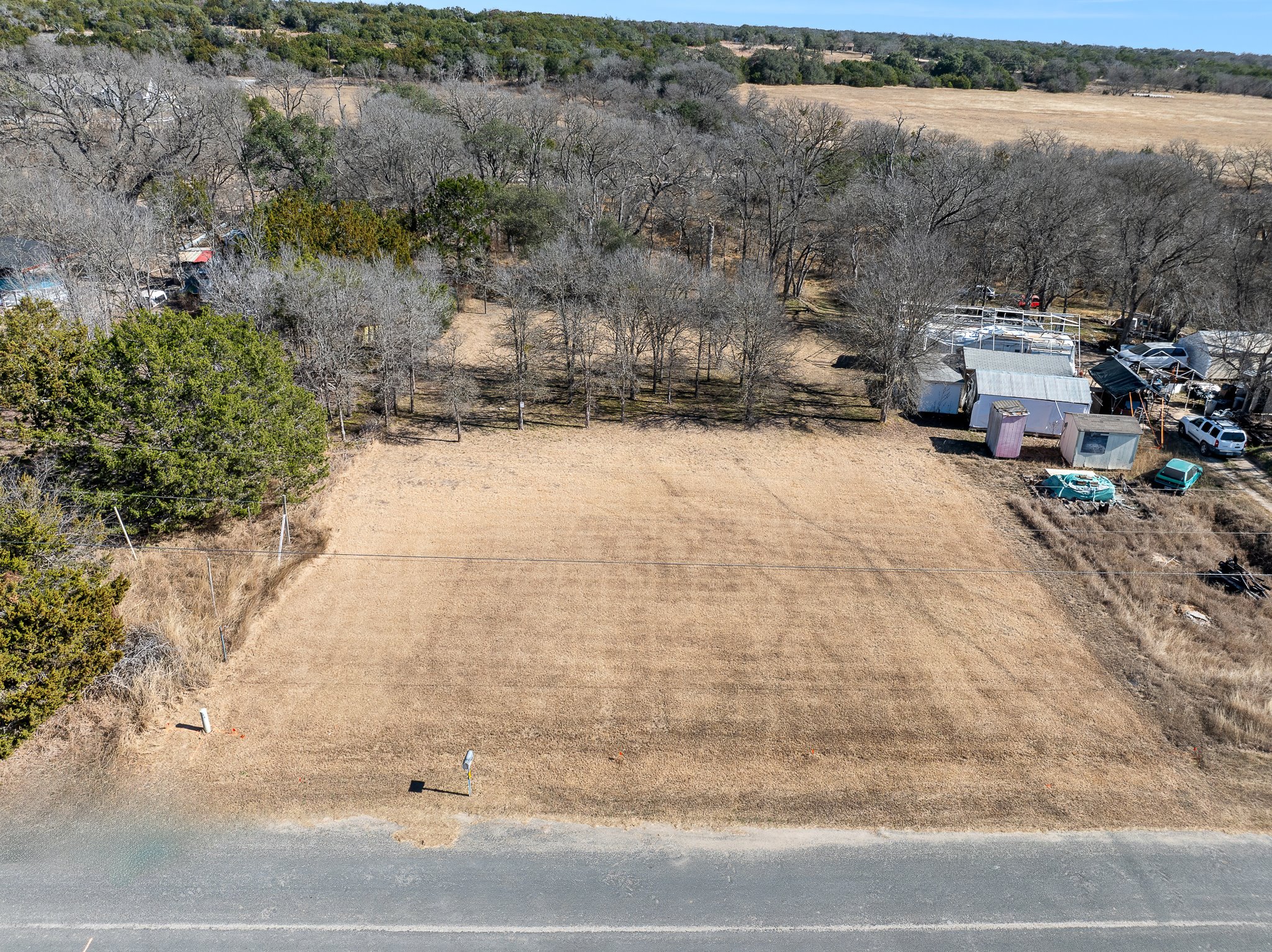 145 River Road Liberty Hill, TX 78642 - Photo 1 of 27 a view of back yard of a house