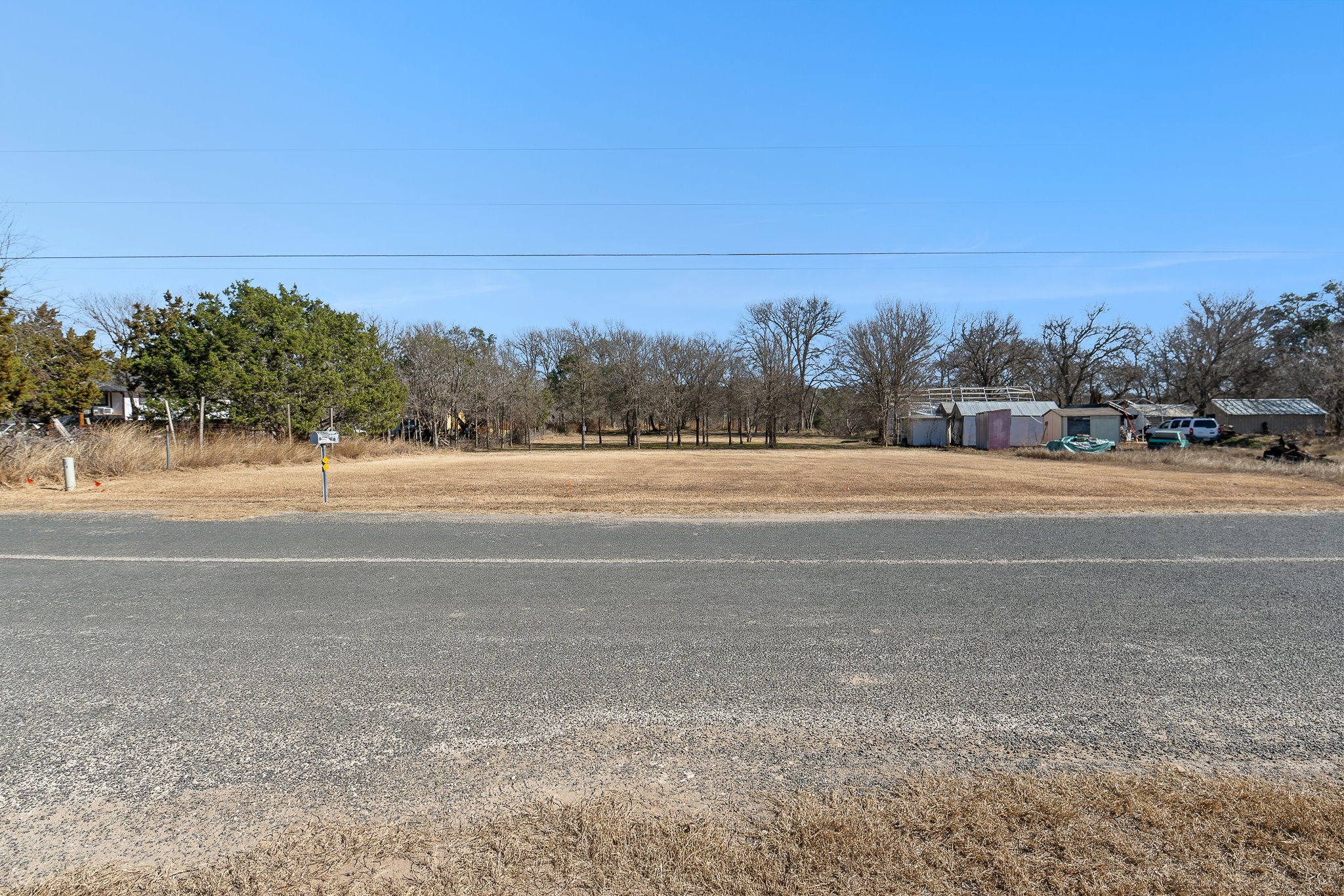 145 River Road Liberty Hill, TX 78642 - Photo 13 of 27 a view of a field and trees in the background