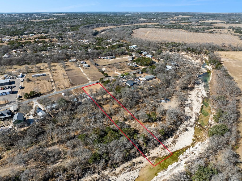 145 River Road Liberty Hill, TX 78642 - Photo 10 of 27 Aerial view of sparsely populated area with property parcel outlined. Boundary lines are approximate.