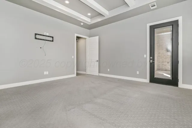 a spacious bathroom with a granite countertop sink a toilet and mirror