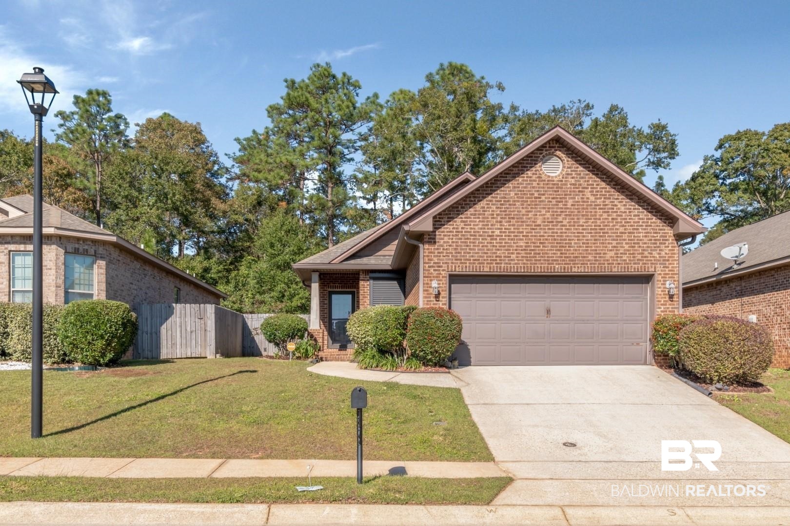 6144 Whitebark Drive Mobile, AL 36693 - Photo 31 of 33 View of front of home with a garage and a front lawn