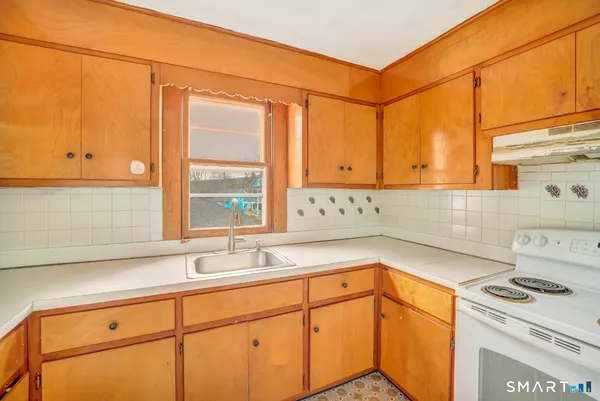 a kitchen with a sink and cabinets
