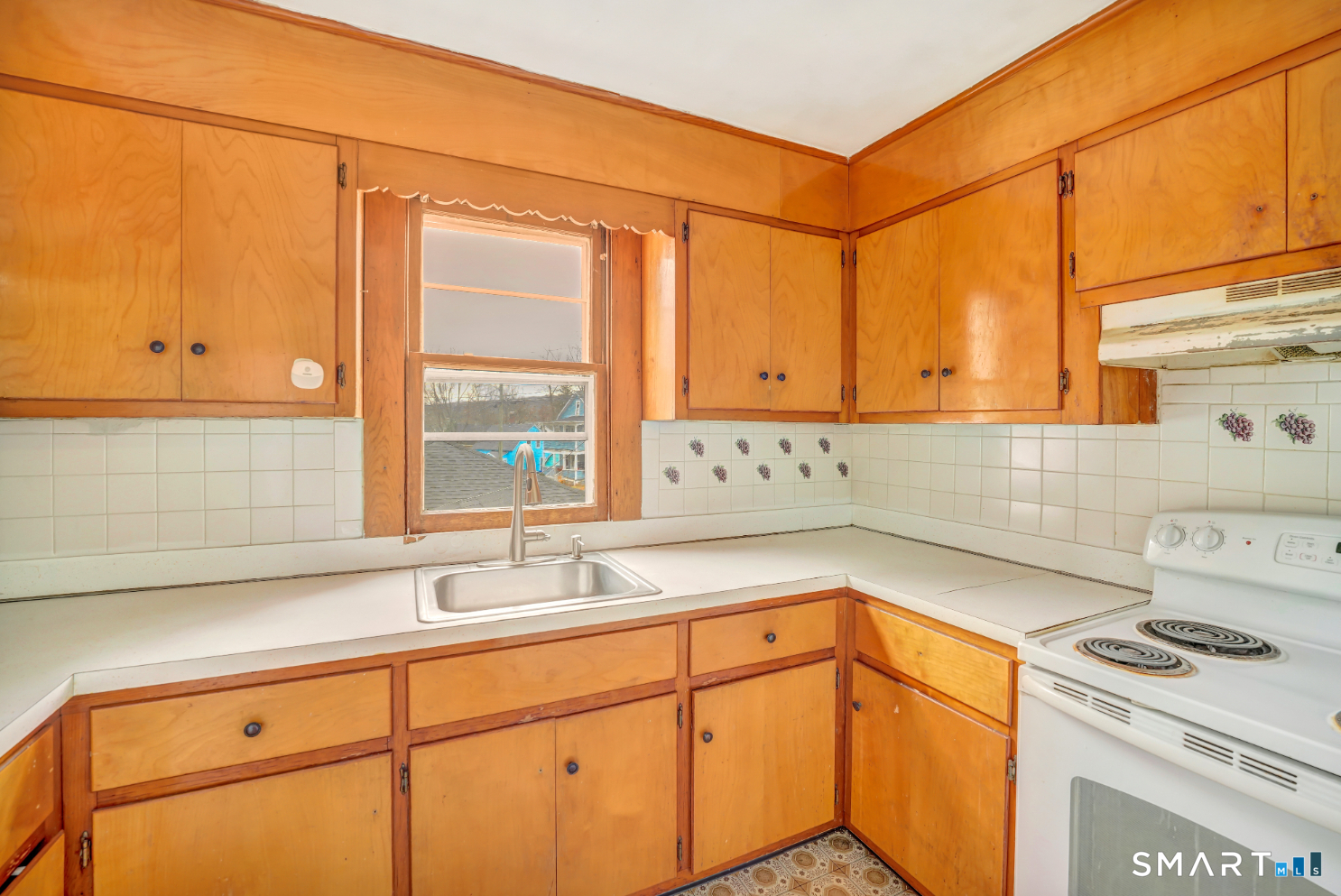 43 Evans Street Torrington, CT 06790 - Photo 5 of 17 a kitchen with a sink and cabinets