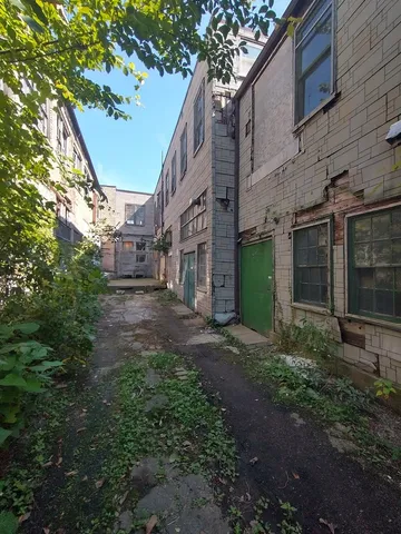 a view of a building with a yard