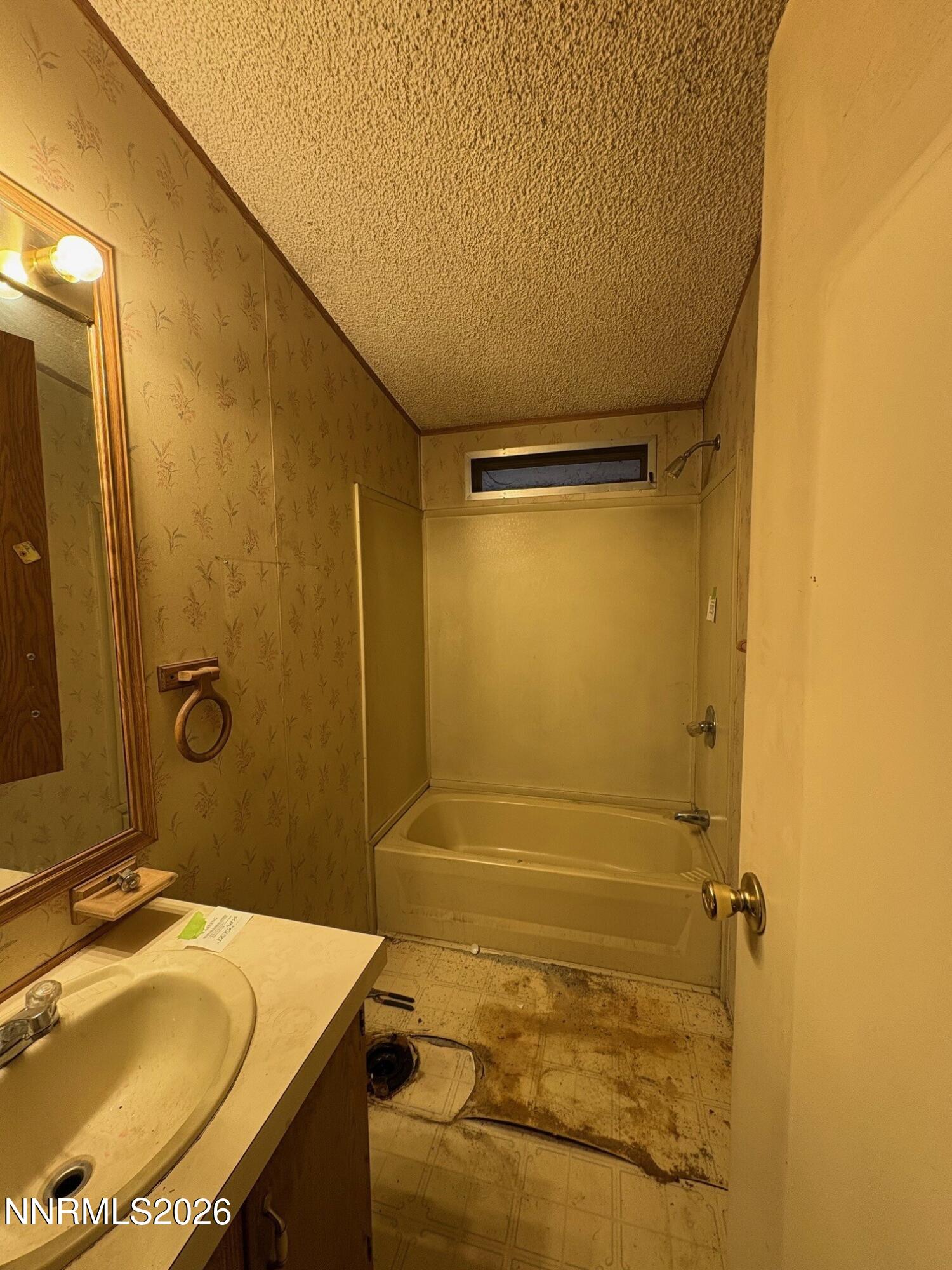 347 Short Avenue Sun Valley, NV 89433 - Photo 13 of 29 a bathroom with a sink and shower