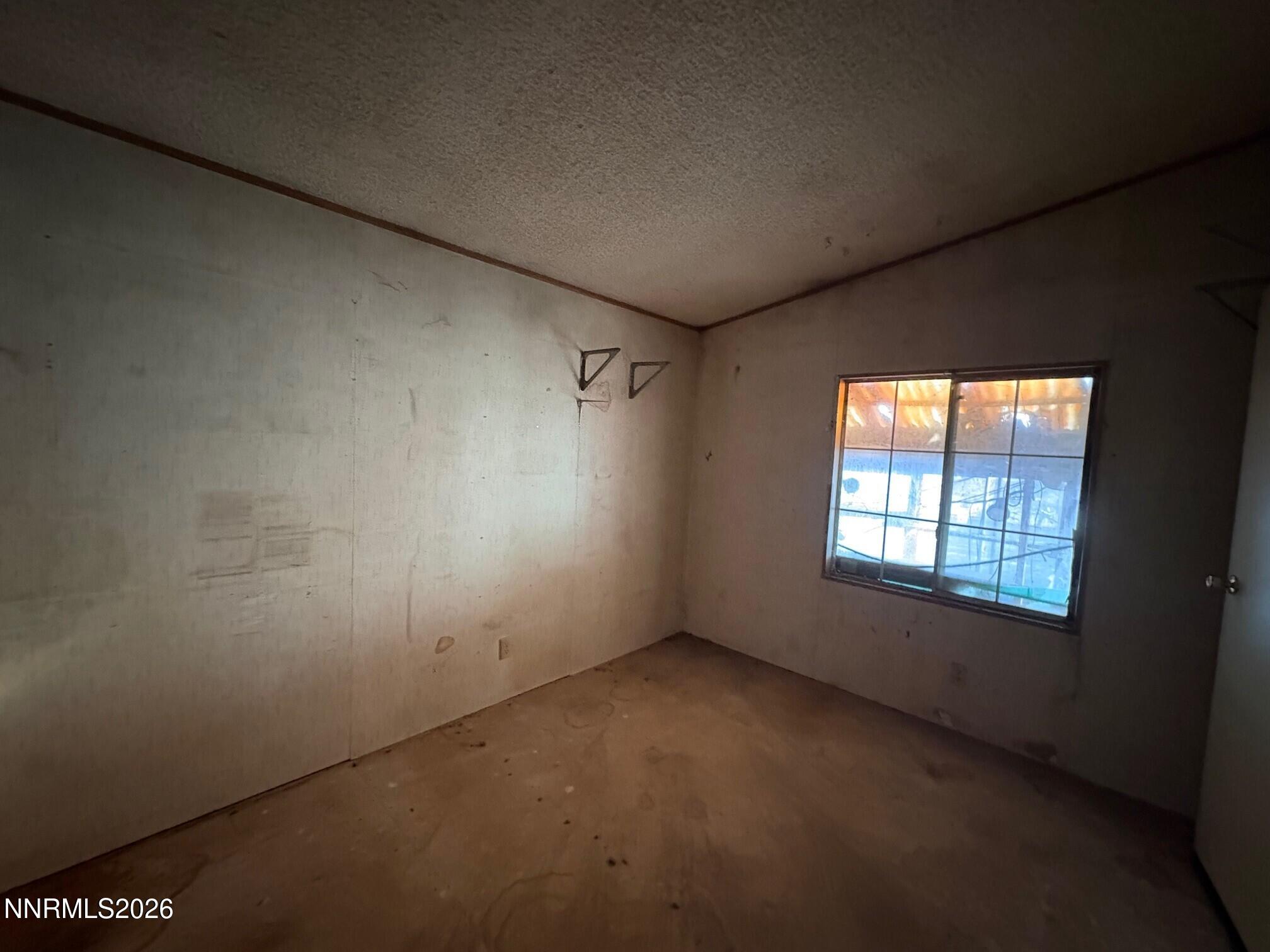 347 Short Avenue Sun Valley, NV 89433 - Photo 15 of 29 an empty room with a empty space and windows
