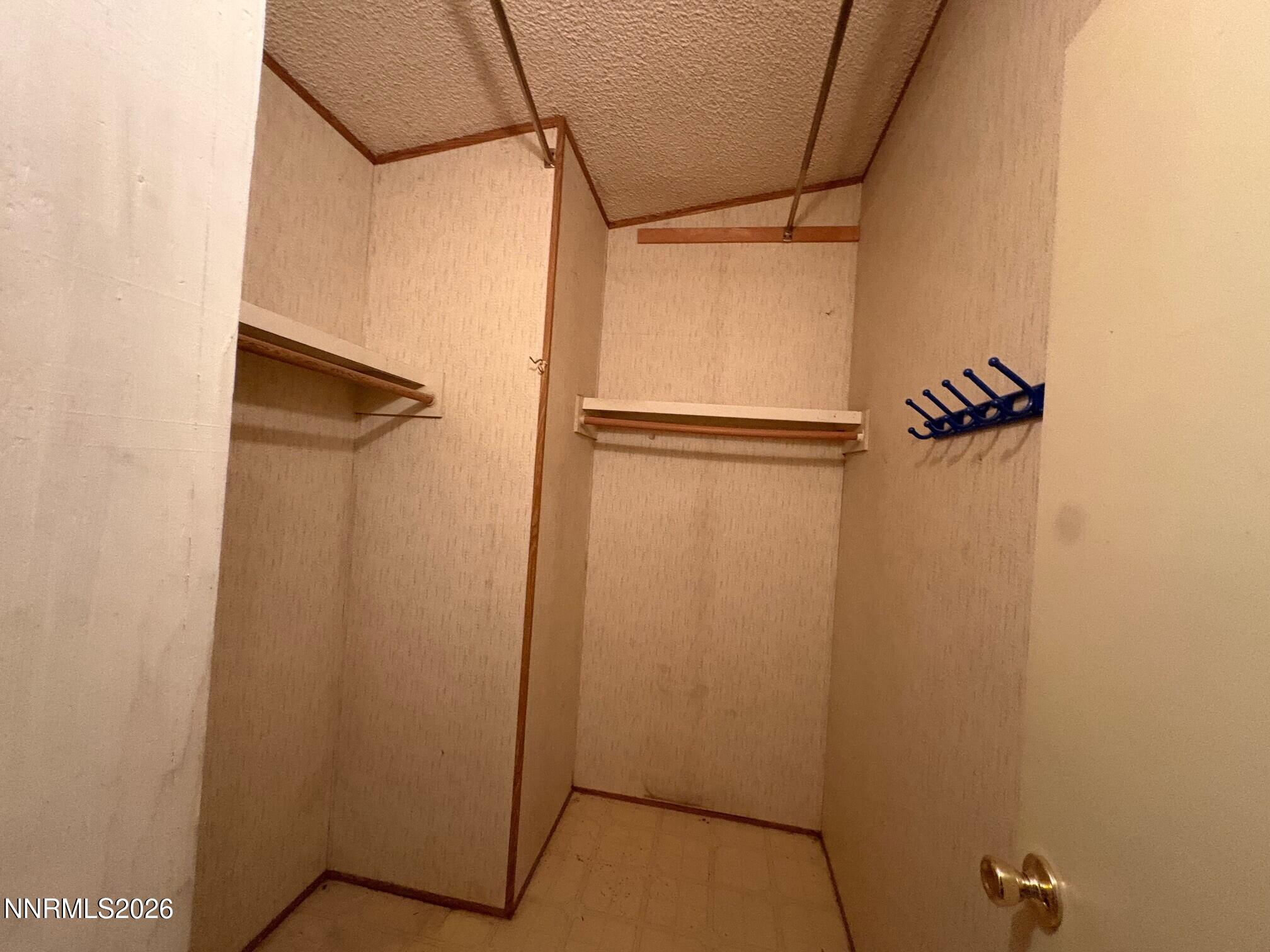 347 Short Avenue Sun Valley, NV 89433 - Photo 17 of 29 a bathroom with a glass shower door