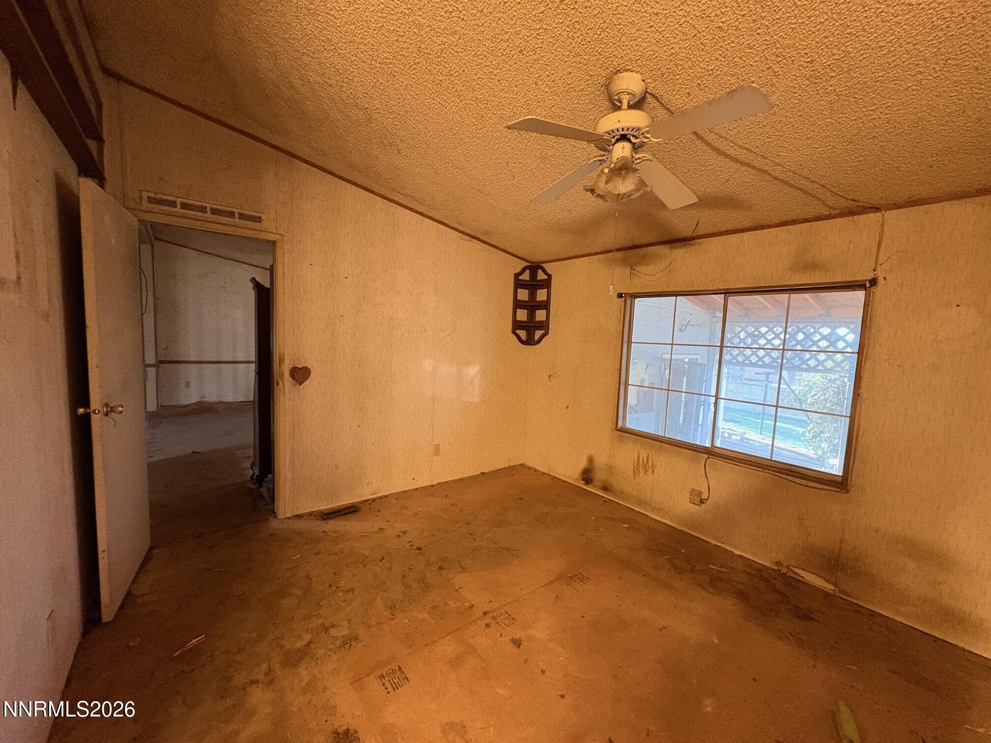 347 Short Avenue Sun Valley, NV 89433 - Photo 20 of 29 an empty room with windows and closet