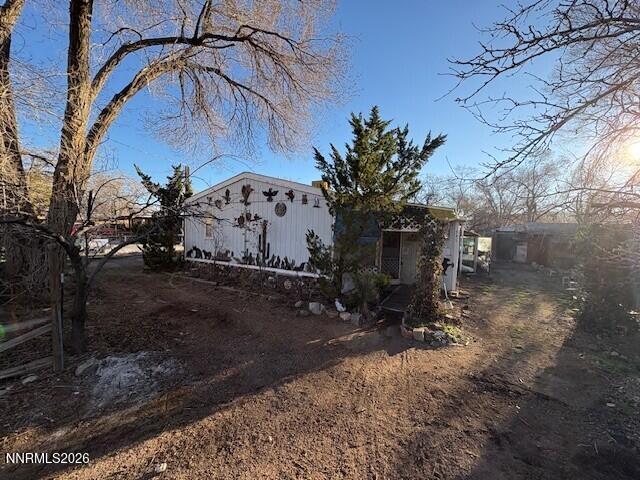 347 Short Avenue Sun Valley, NV 89433 - Photo 2 of 29 a view of a backyard with plants and trees