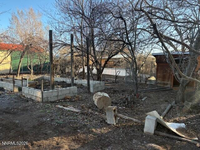 347 Short Avenue Sun Valley, NV 89433 - Photo 26 of 29 a backyard of a house with table and chairs