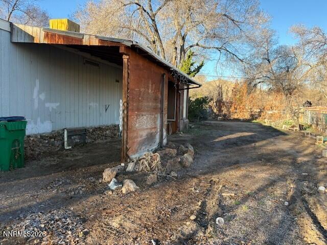 347 Short Avenue Sun Valley, NV 89433 - Photo 5 of 29 a view of a barn in the middle of a yard
