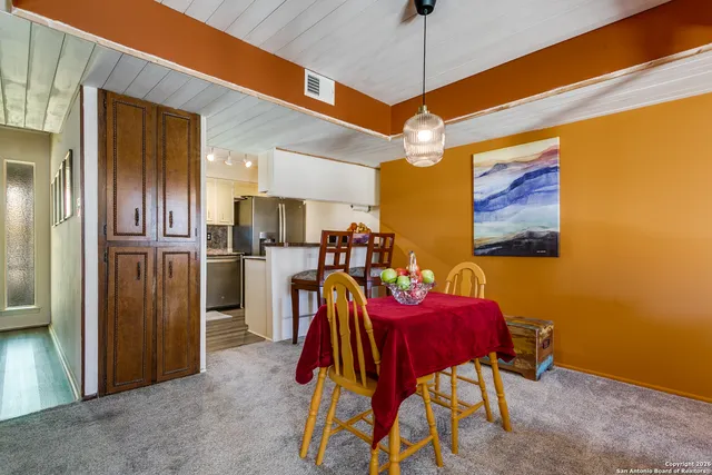 a view of a dining room with furniture