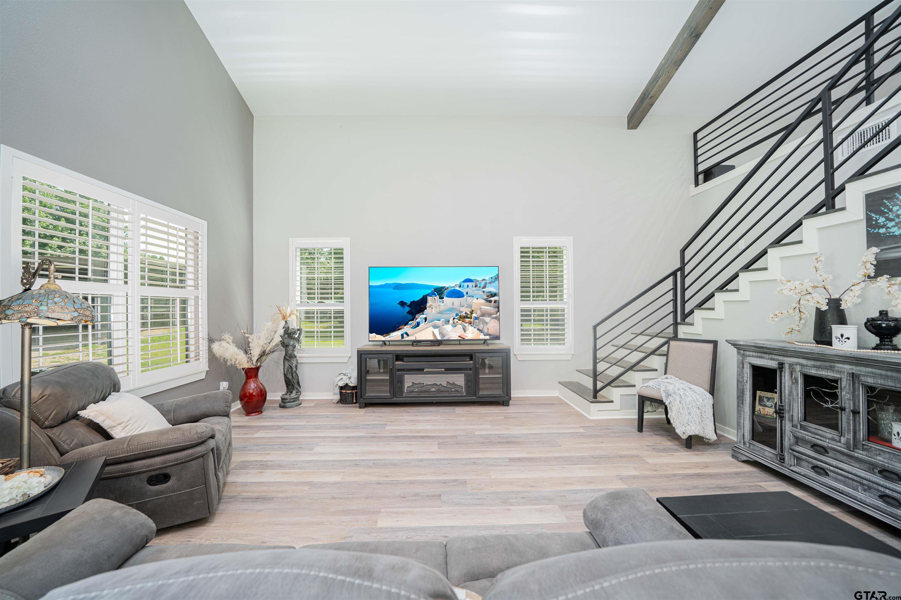 7635 Highway 271 Mount Pleasant, TX 75455 - Photo 8 of 46 a living room with furniture and a chandelier