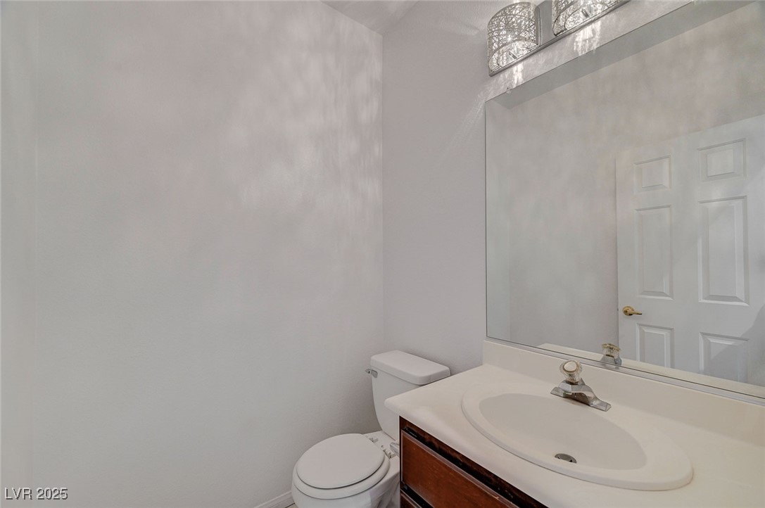 6012 Prospector Trail Las Vegas, NV 89118 - Photo 26 of 73 Bathroom featuring vanity and toilet