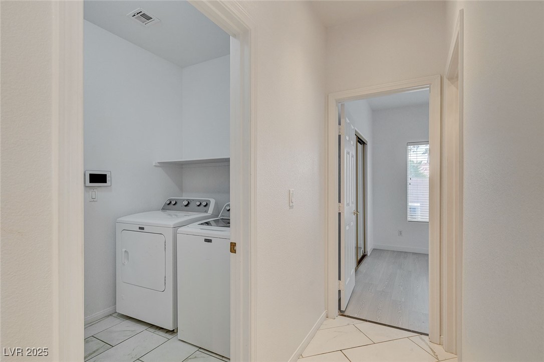 6012 Prospector Trail Las Vegas, NV 89118 - Photo 27 of 73 Washroom with light tile patterned floors and independent washer and dryer