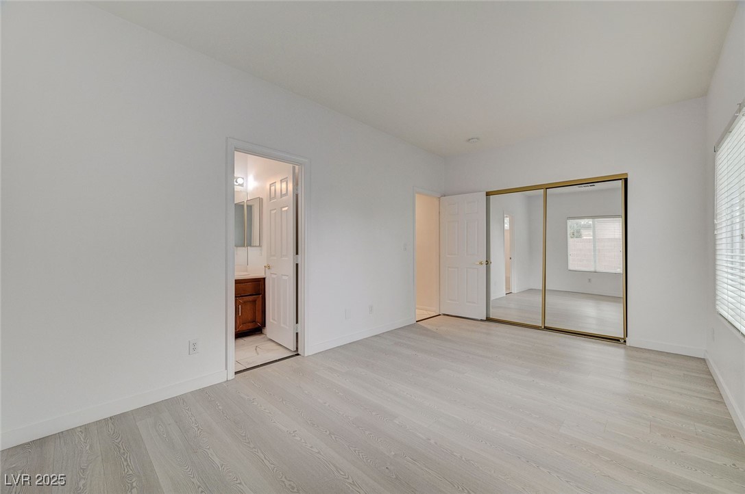 6012 Prospector Trail Las Vegas, NV 89118 - Photo 29 of 73 Unfurnished bedroom with light wood-style flooring and a closet