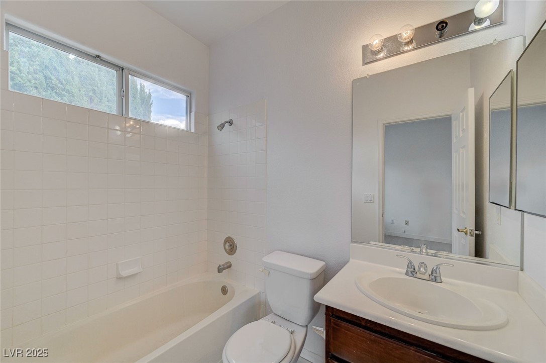 6012 Prospector Trail Las Vegas, NV 89118 - Photo 30 of 73 Bathroom featuring bathing tub / shower combination and vanity