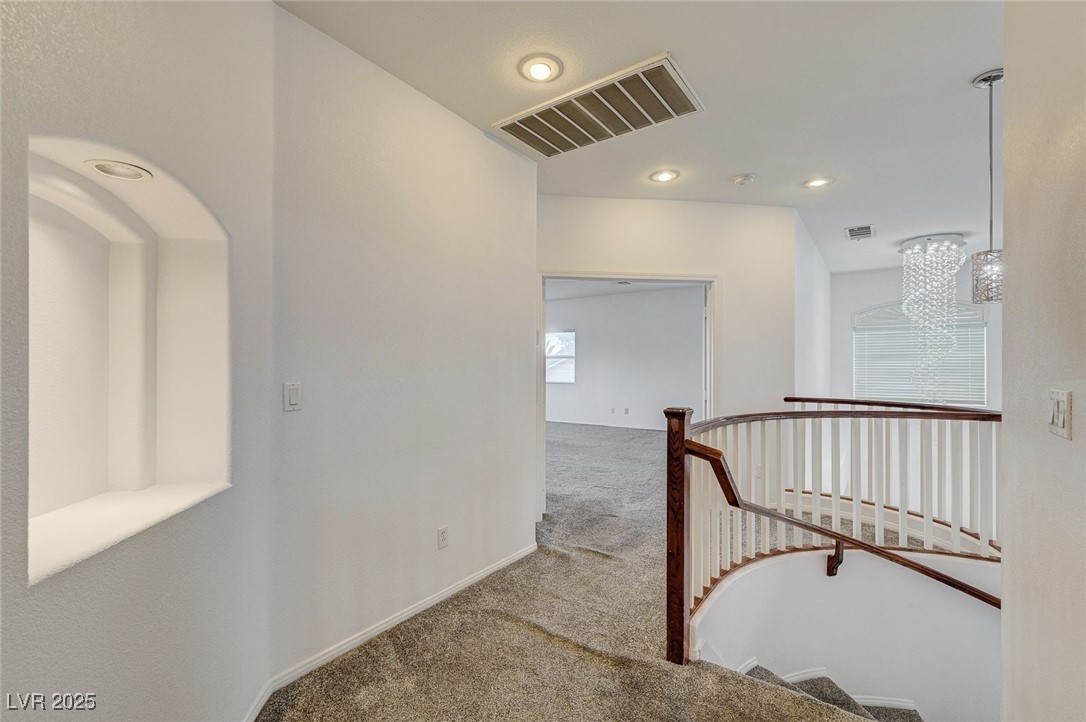6012 Prospector Trail Las Vegas, NV 89118 - Photo 33 of 73 Staircase featuring carpet floors, a chandelier, and recessed lighting