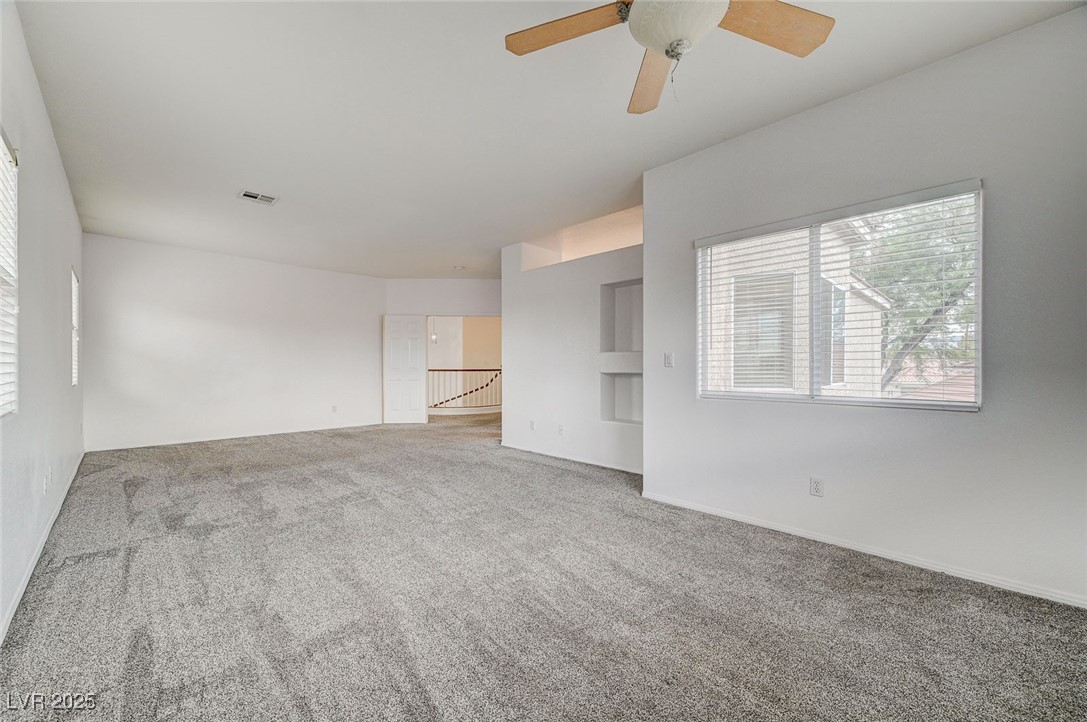 6012 Prospector Trail Las Vegas, NV 89118 - Photo 38 of 73 Carpeted spare room featuring baseboards and a ceiling fan