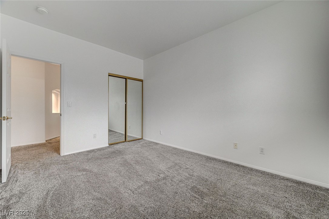 6012 Prospector Trail Las Vegas, NV 89118 - Photo 50 of 73 Unfurnished bedroom with carpet flooring and a closet