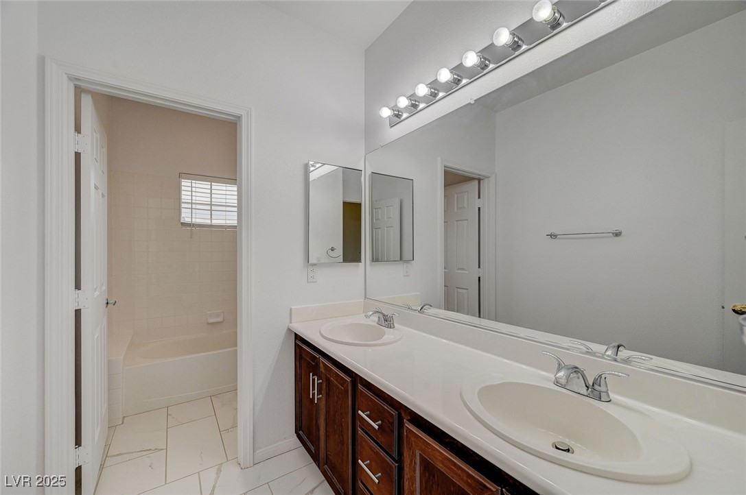 6012 Prospector Trail Las Vegas, NV 89118 - Photo 51 of 73 Full bath featuring double vanity and shower / tub combination