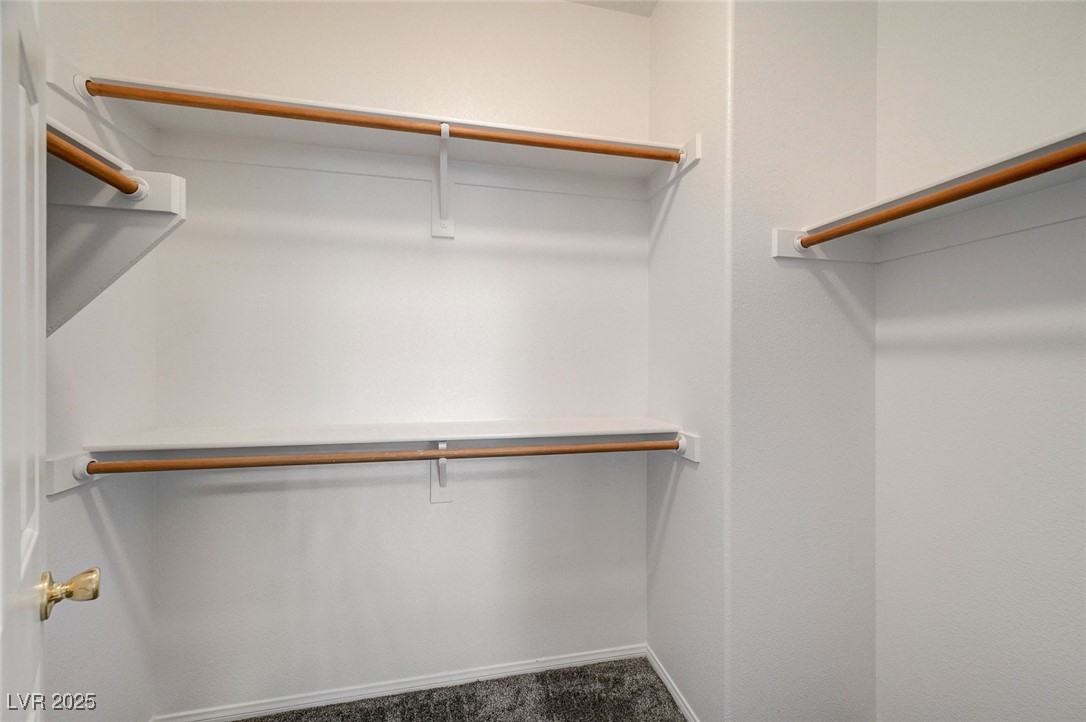 6012 Prospector Trail Las Vegas, NV 89118 - Photo 58 of 73 Walk in closet with dark carpet