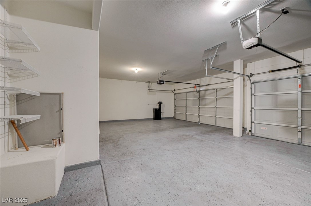 6012 Prospector Trail Las Vegas, NV 89118 - Photo 60 of 73 Garage featuring a garage door opener