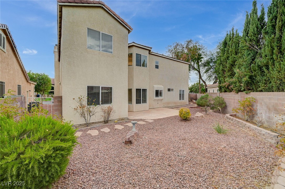 6012 Prospector Trail Las Vegas, NV 89118 - Photo 65 of 73 Rear view of house featuring a patio, a fenced backyard, stucco siding, and a tile roof