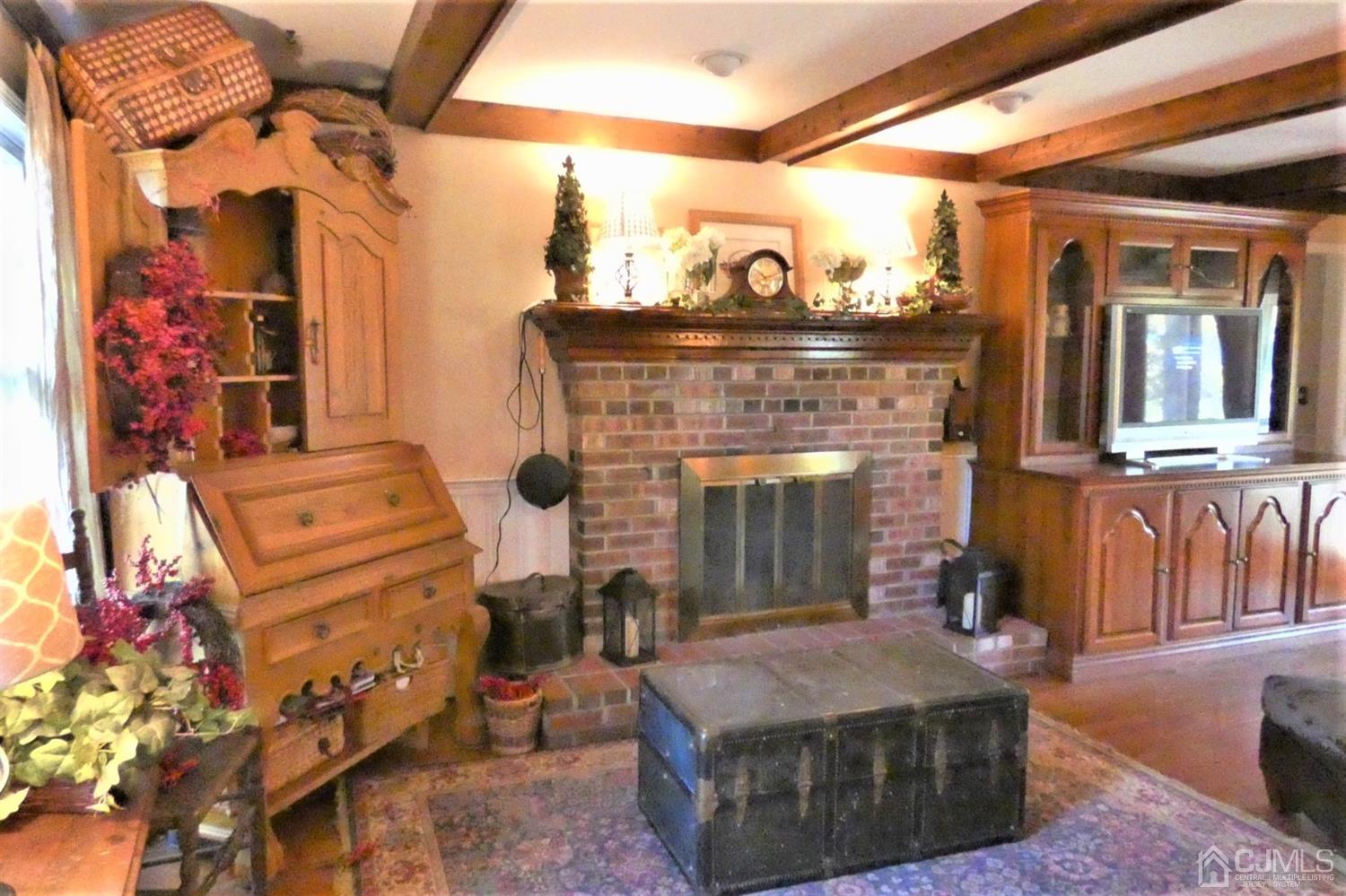 14 Apple Tree Road Flemington, NJ 08822 - Photo 14 of 33 a view of living room kitchen with furniture and fireplace