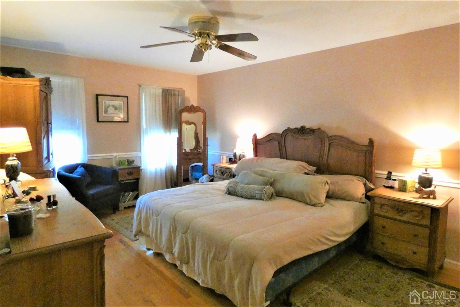 14 Apple Tree Road Flemington, NJ 08822 - Photo 16 of 33 a bedroom with a bed and a chandelier